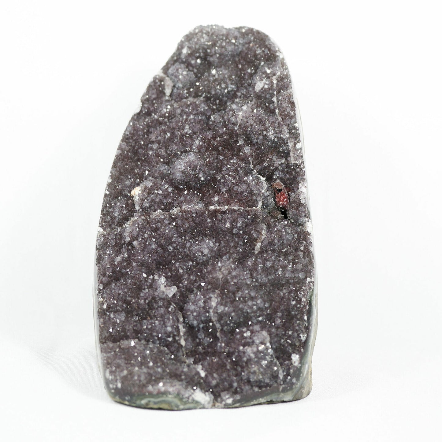 Super large purple amethyst cluster with red point and white belts front