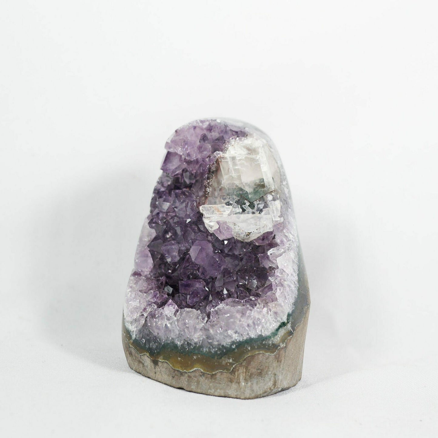 Exquisite amethyst base cluster with calcite and two generational drazy sugar front