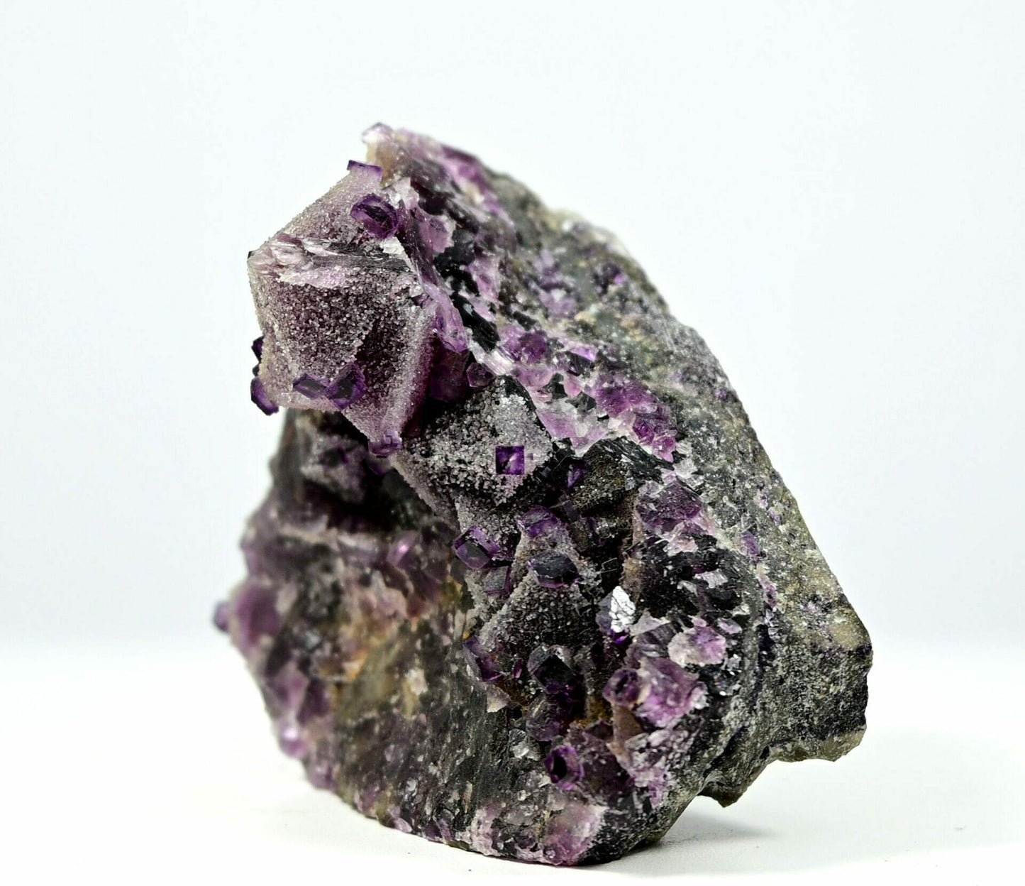 Unusual complete purple fluorite with multiple generation sugar drazy covered and some calcite side 2