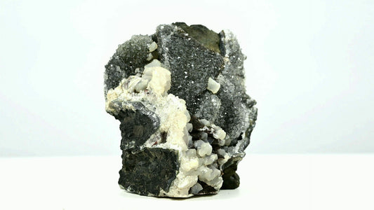 Black druzy crystals with multiple calcite formations and second generations side 1