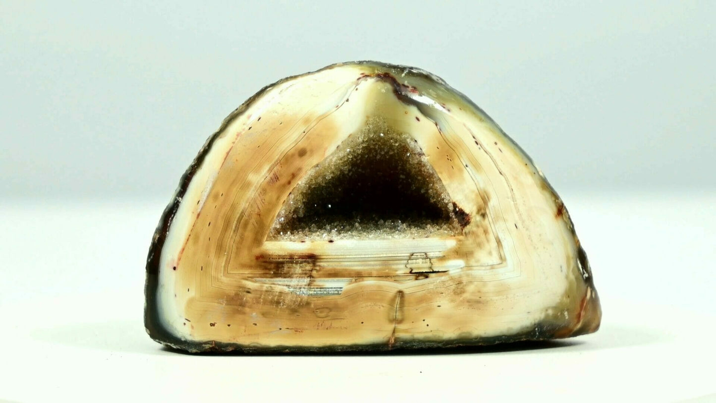 Super beautiful agate triangle geode druse with yellow crystal inside and light is able to go through front