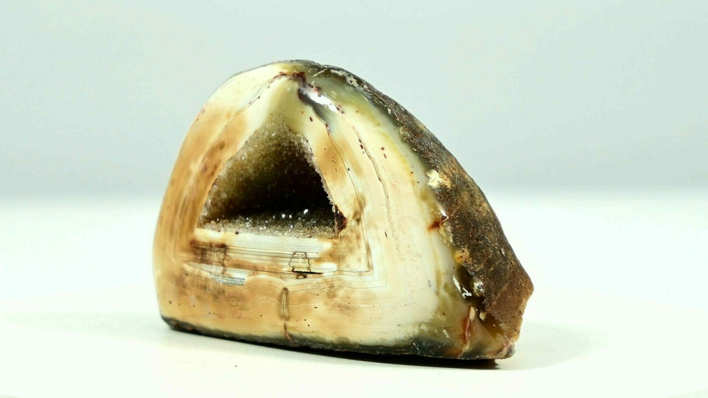 Super beautiful agate triangle geode druse with yellow crystal inside and light is able to go through side 2