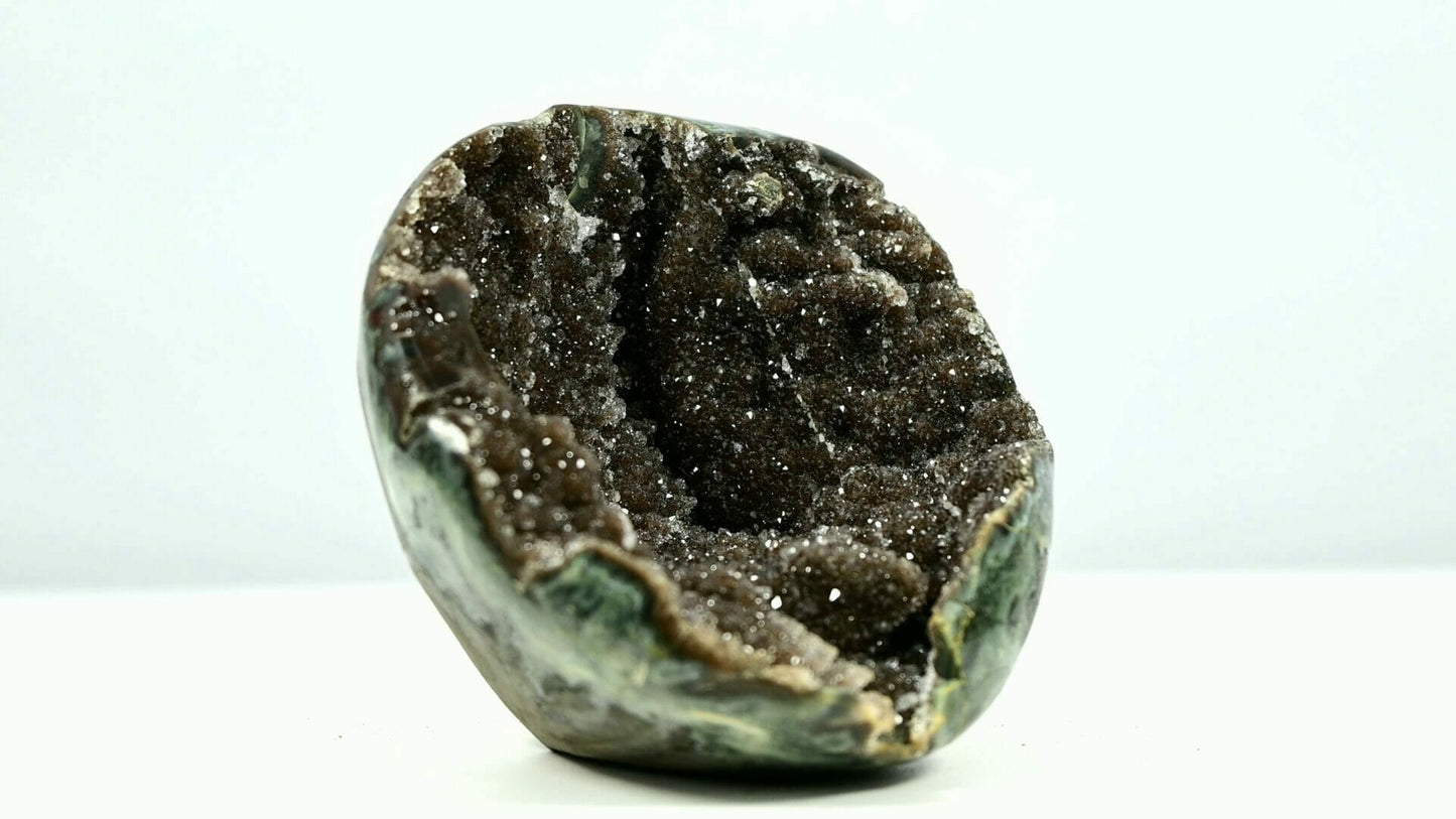 Super bling brown sugar druzy geode bowl with some belts and tiny trees inside side 2